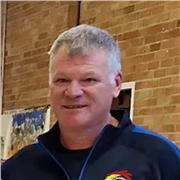 Friendly, patient tutor helping adults improve English fluency.